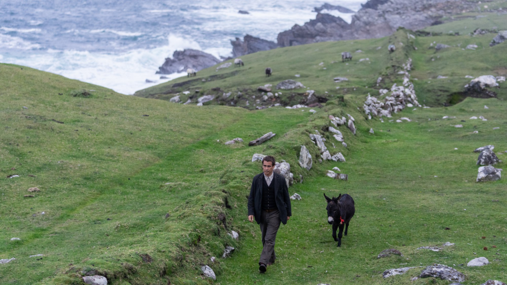 Colin Farrell as Padraic walking with Jenny the Donkey in The Banshees of Inisherin